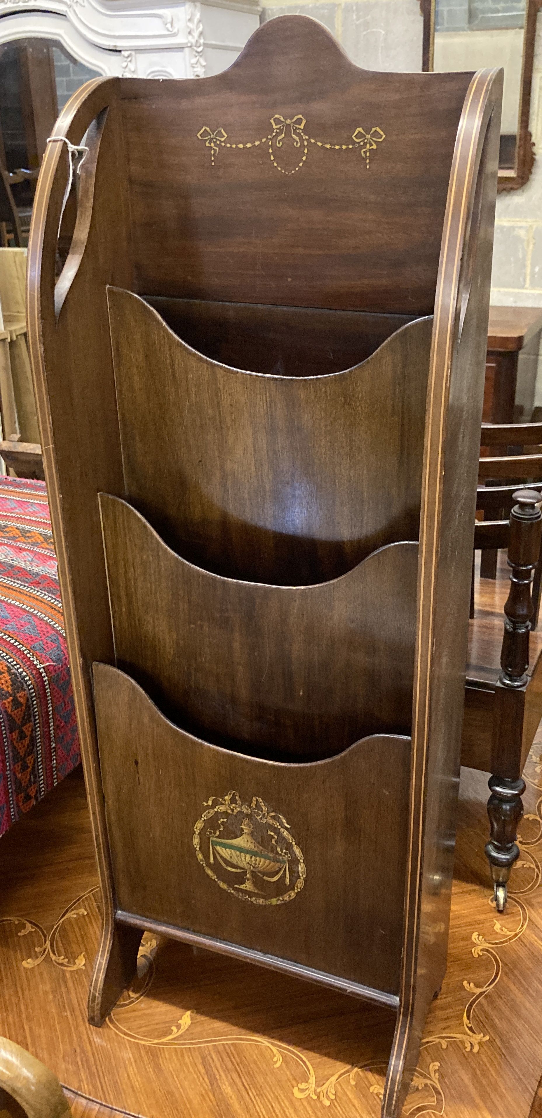 An Edwardian mahogany stencil decorated newspaper stand, width 37cm, depth 22cm, height 102cm